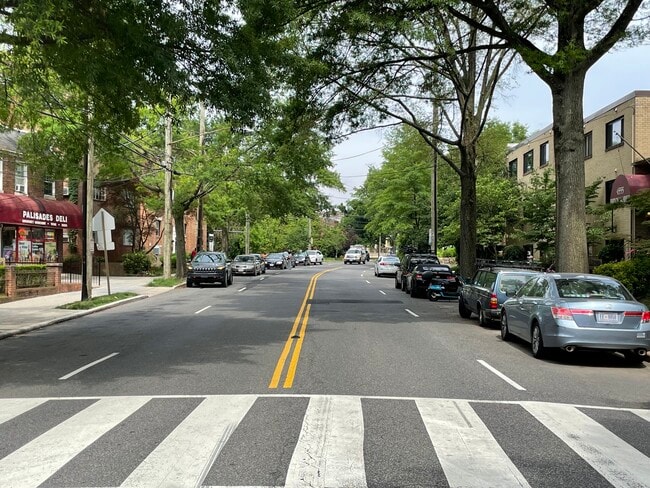 Looking west along MacArthur Blvd. Our condo building (right) and the Palisades Deli (left) - 4555 MacArthur Blvd NW