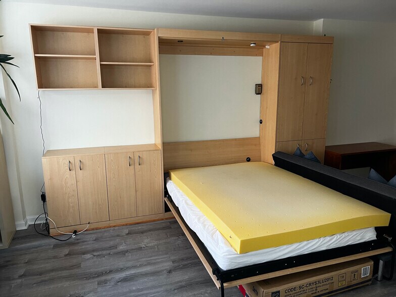 fold-down Murphy bed with memory-foam mattress topper (can be removed if tenant doesn't want it) - 1420 N St NW