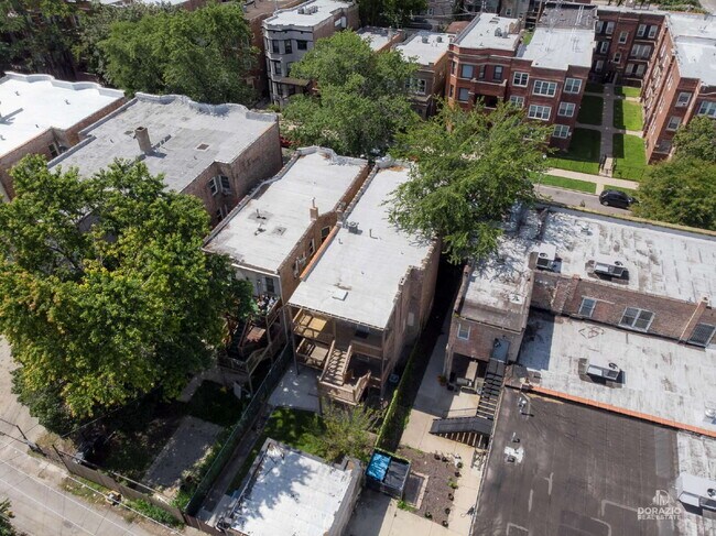 Building Photo - Modern 4BR Apartment with Hardwood Floors, Balcony & Central A/C