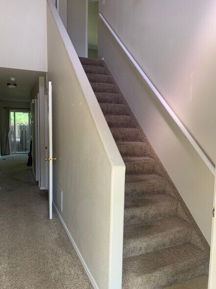 Hall to living area & stairs - 2232 Golden Gate Grv