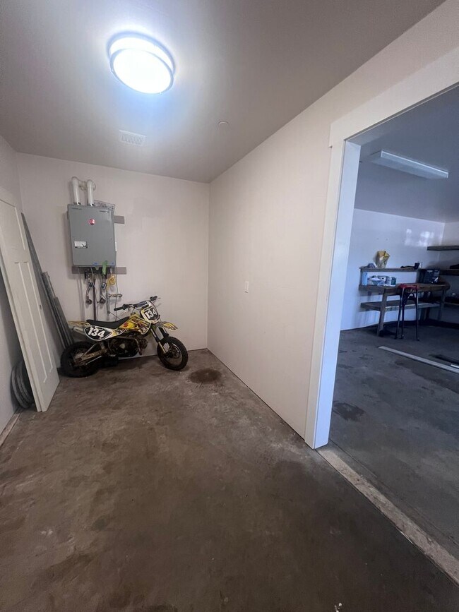 Building Photo - 2 Bedroom 1 bath house with extra large double car garage and extra storage space!