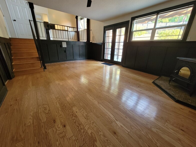 Lower Living Room w/ Woodstove - 8514 41st St W