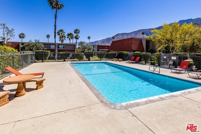 Building Photo - Furnished (also available unfurnished - please inquire) 3-Bedroom Townhome in a Gated Palm Spring...