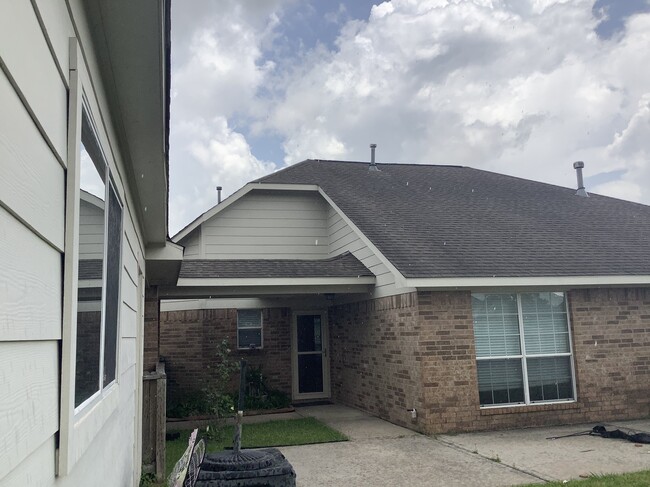 View of back door and path to driveway - 11502 Grimes Ave