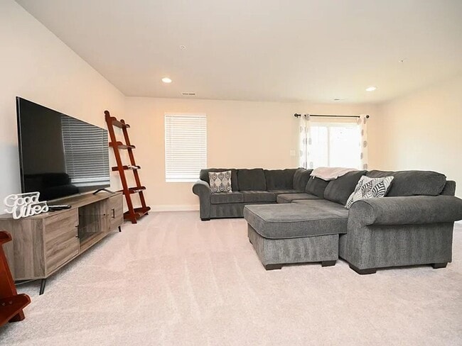 Building Photo - Stunning 3-Story Brick-Front Townhome | Modern Living + Military & First Responder Discount