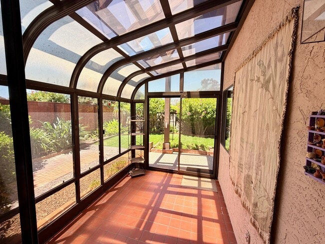 Building Photo - Private Oasis with Sunroom, Balcony & Lush Landscaping | 4BR Home Near Community Pool & Spa