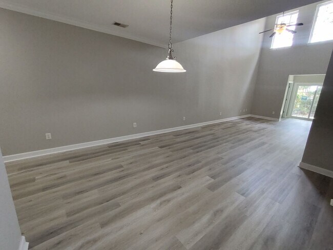 Building Photo - BRAND NEW FLOORING & FRESH PAINT - 3 Bedroom/2.5 Bath Townhome with garage in Wild Wing!