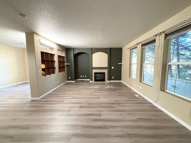 Building Photo - Stunning Remodeled Home with Office, A/C, Fenced Yard & Flexible Living Space!