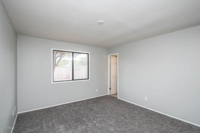 Building Photo - COMPLETELY REMODELED 4 BEDROOM, 2 BATH TEM...