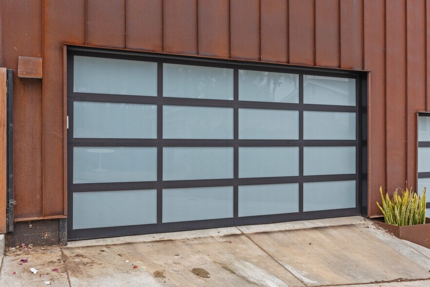 Custom two car garage with EV charging, laundry and attic storage space. - 4640 Del Monte Ave