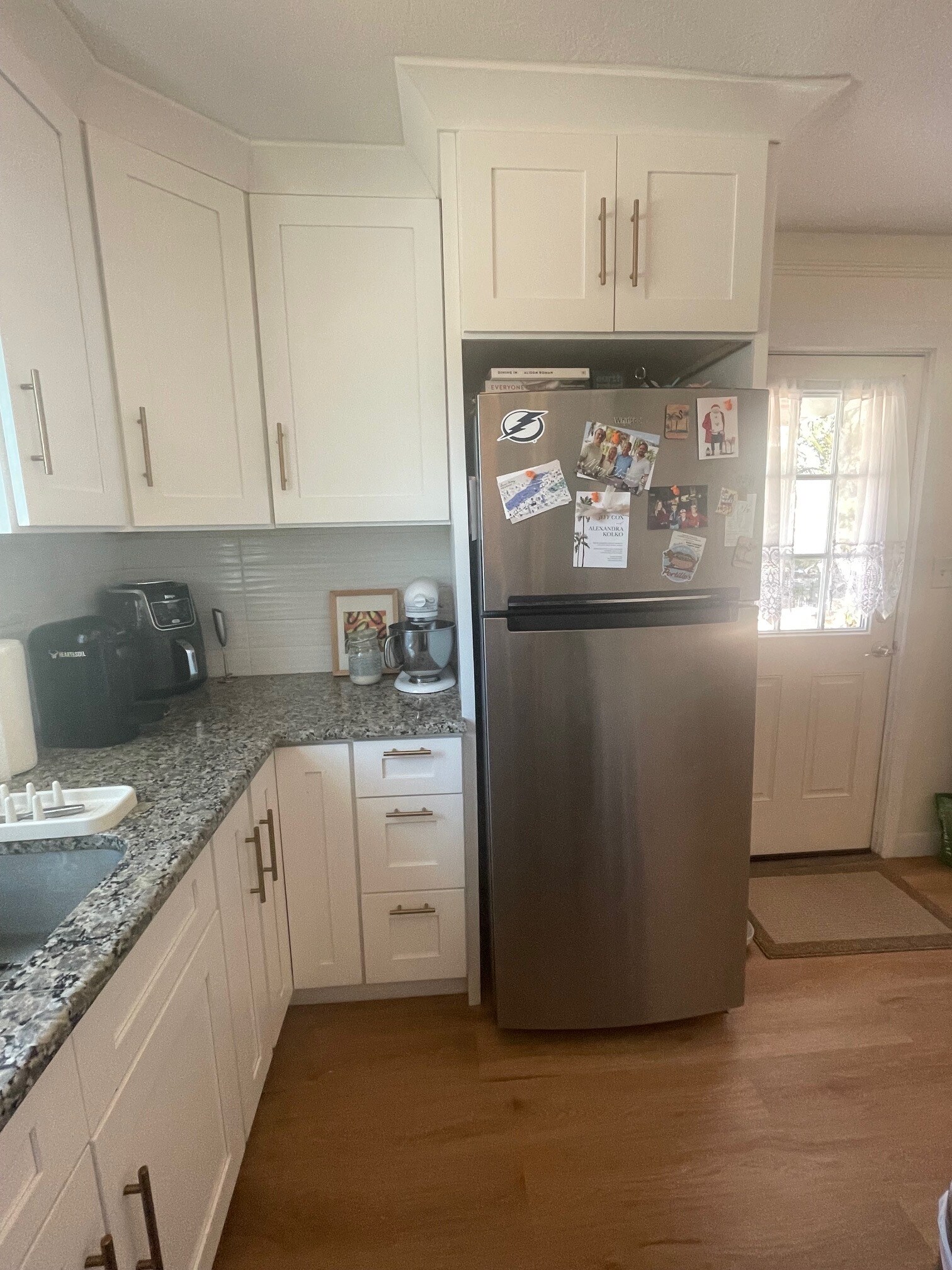 Kitchen - view of fridge and front door - 1134 Bay St NE