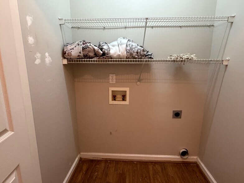 Laundry room is located on the main level as you enter from the garage - 6419 Woodmont Rd