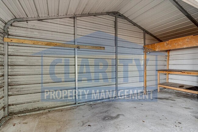 Building Photo - Updated house with carport and shed on corner lot!
