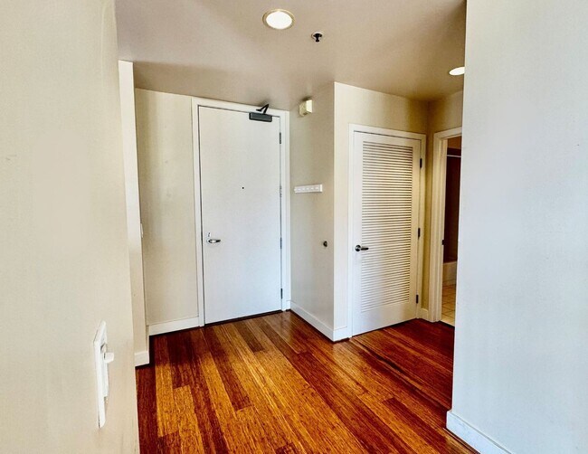 Building Photo - Corner Light. City Energy. Zero Compromise.