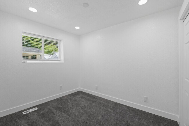 Building Photo - Complete Rebuild Modern Finishes 3 Bedroom 2 Bath Spokane Valley Home fenced backyard