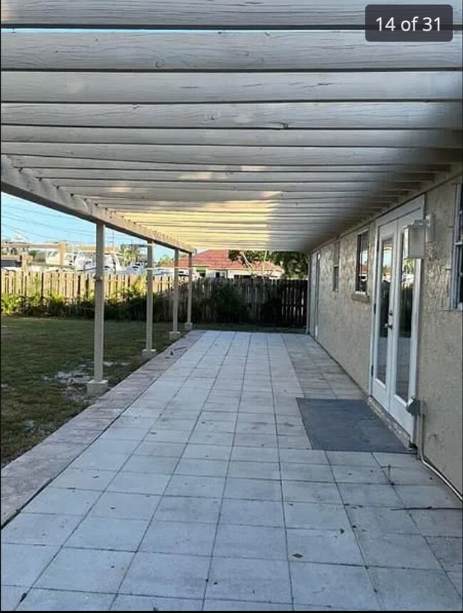 Building Photo - 2/2/1 home with a spacious fenced backyard...