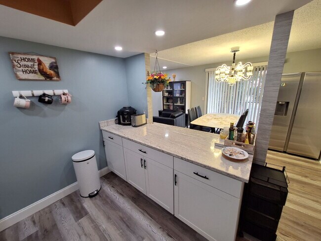 Building Photo - Second Floor Annual rental available now in the 55+ condominium community of Cedar Woods.