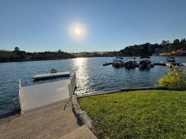 Building Photo - Home located in a gated Lakefront community with 3 swim areas & a boat dock