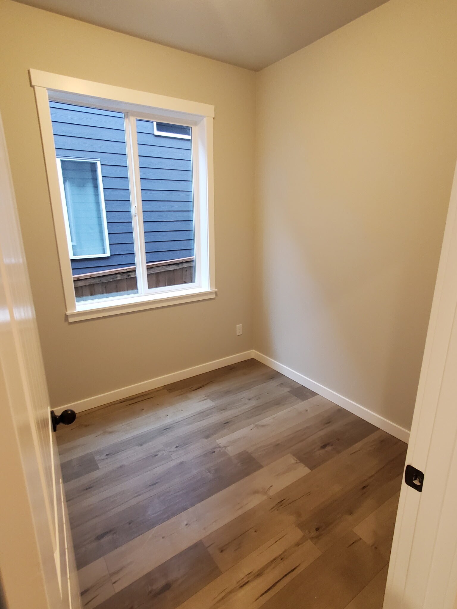 The extra room downstairs that can be used for workspace - fits a desk chair and other items - 161 E Wayno Way