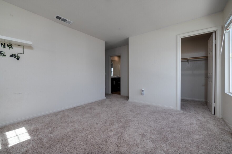 Bright first upstairs bedroom featuring direct access to the hallway, shared bathroom - 26549 Brightstone Dr