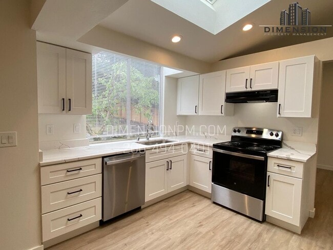 Building Photo - Stylishly Renovated Home with Private Back...