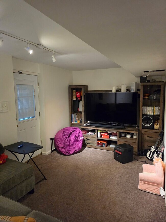 Building Photo - Stunning 3–4 Bedroom Townhome in Private Community | Garage + EV Charger | Deck with Tree Views