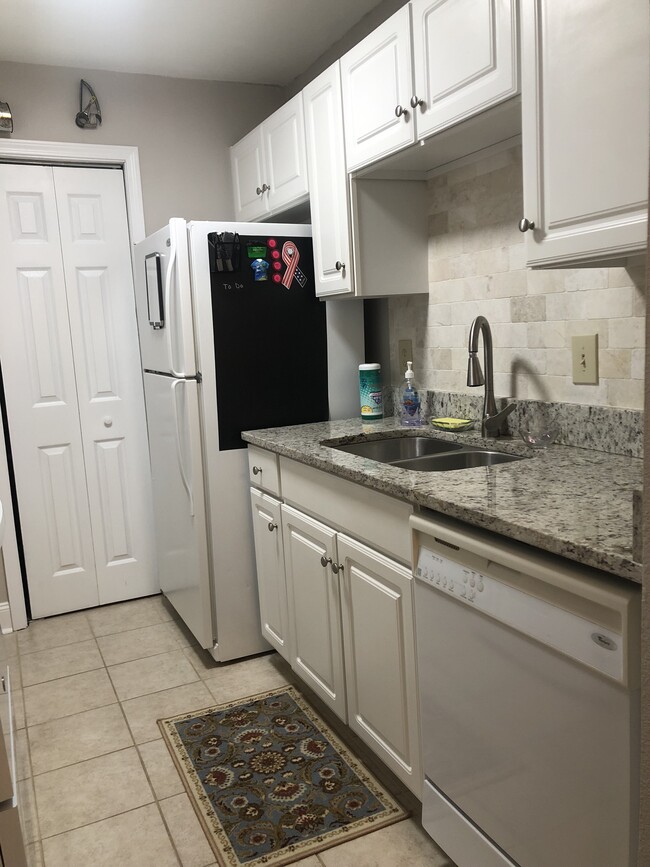 Galley kitchen right side, with pantry. - 3565 Sable Palm Ln