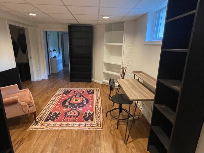 from den area pocket doors bedroom 1 to left and bedroom 2 straight ahead. Both with ensuite baths - 1869 Park Rd NW