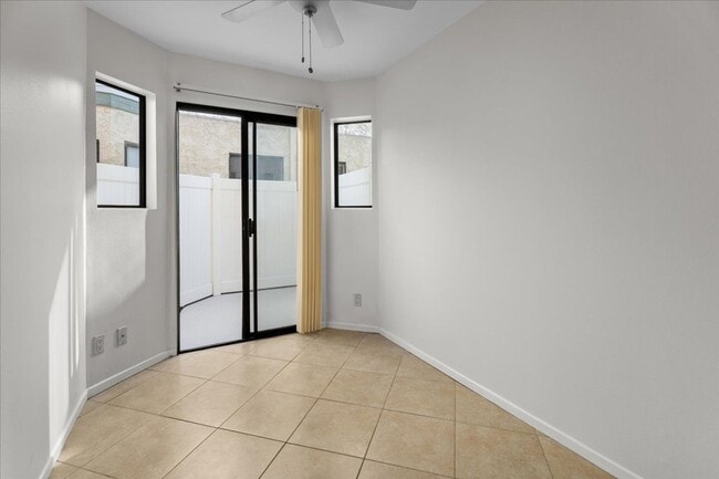 Building Photo - Light Filled Townhome Style Condo with Private Patios and Direct Access