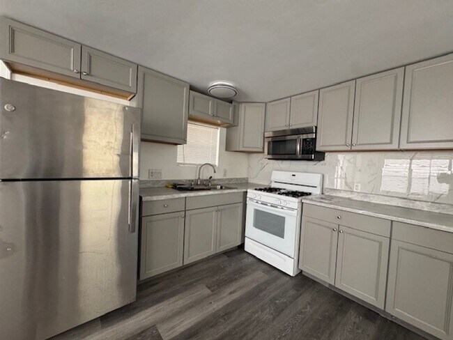 Building Photo - Parially Furnished 2BR 1BA Remodeled-Fenced Yard + RV/Coach cement Parking