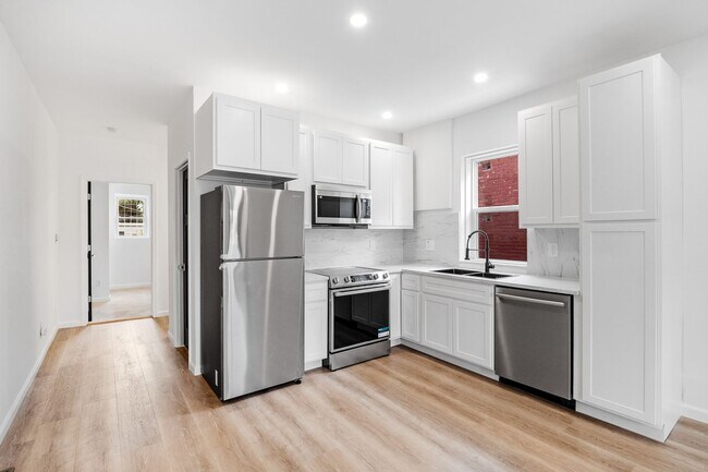 Building Photo - $1795 - Single Family Home with Private Two-Level Living Spaces, Driveway Parking & Modern Updates