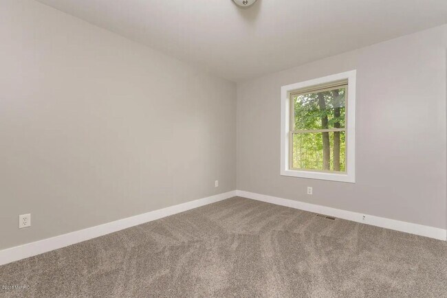Building Photo - Spacious 3BR Duplex with Finished Basement & 2-Car Garage in Otsego