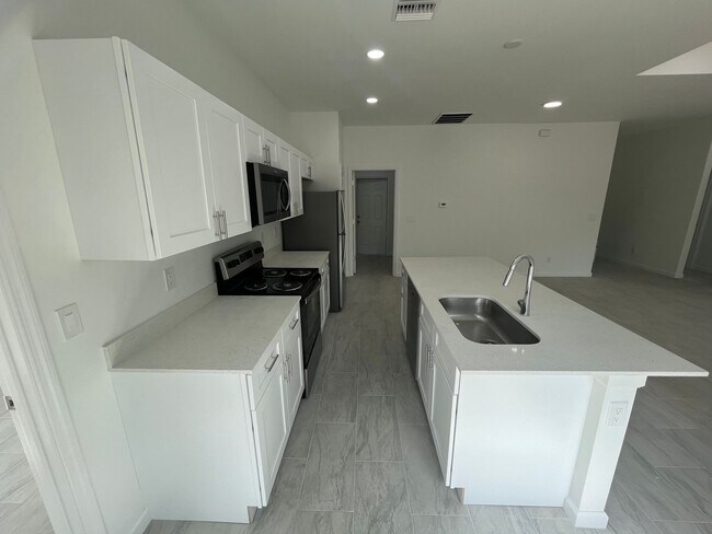 Building Photo - BRAND NEW MODERN SF HOME 3BD+den/2BA with GARAGE IN LEHIGH ACRES!