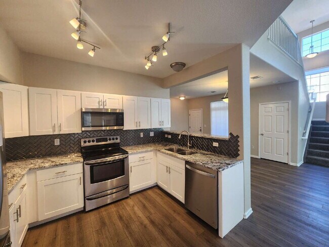 Building Photo - Spacious Two-Suite Townhome With Garage, Fireplace And Community Pool