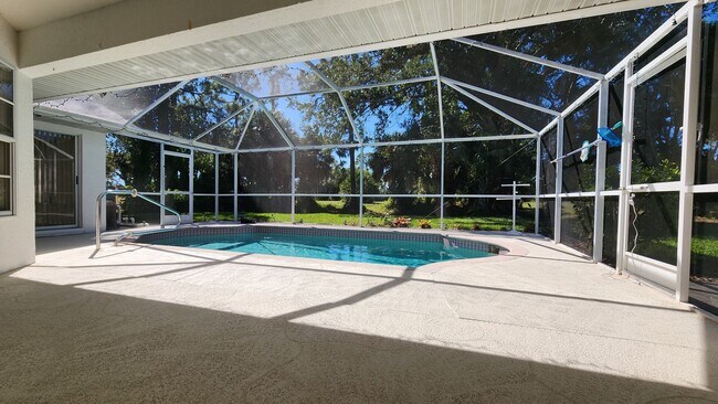 Building Photo - Fresh Paint, New Floors, and a Heated Pool...