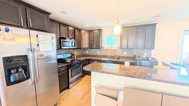 Building Photo - Spacious Townhouse: 4-bed, 3.5 bath unit in Brighton with Garage Parking