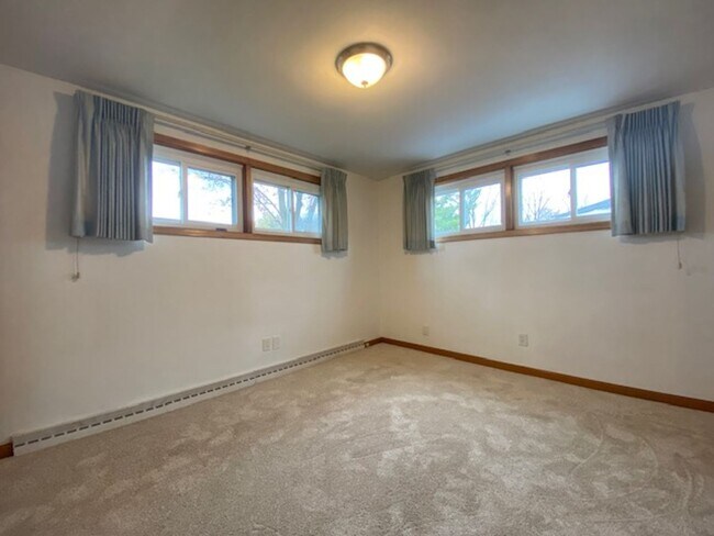 Building Photo - Welcome to this charming three-bedroom, tw...