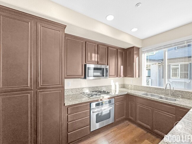 Building Photo - Modern 3-Story Townhome in Bay Park – 3BR/3.5BA with Pool, Balcony & In-Unit Laundry