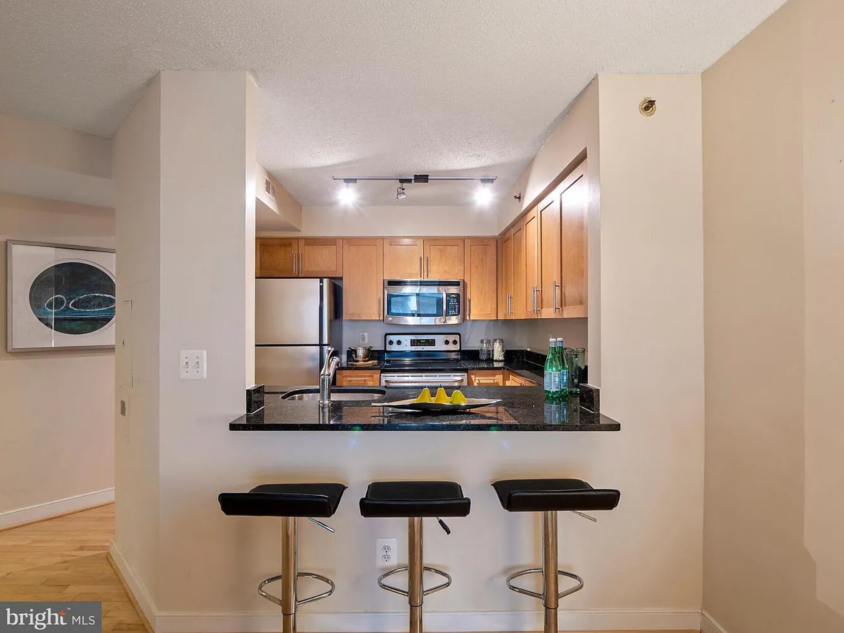 Kitchen open to living room - 7500 Woodmont Ave