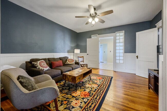 Downstairs TV room couch and chair - 1608 Fayetteville St