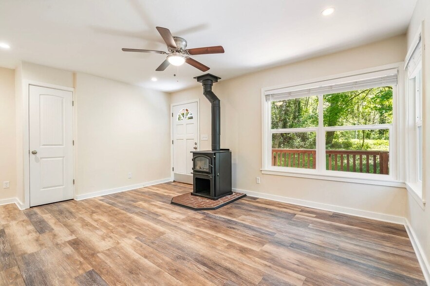 Front Room with Woodstove - 20220 E Peter Pl