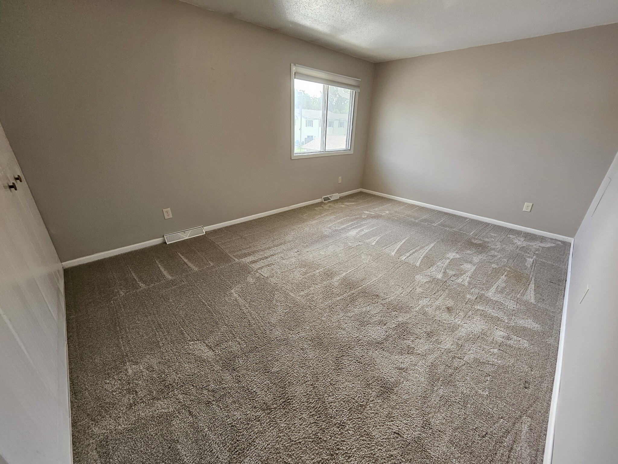Bright, roomy 11' X 16' master bedroom with large window. - 2353 Mailand Ct E