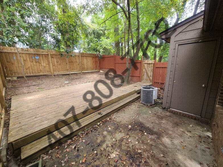 Backyard. Fence and Deck have been painted completely - 1075 Ocala Rd