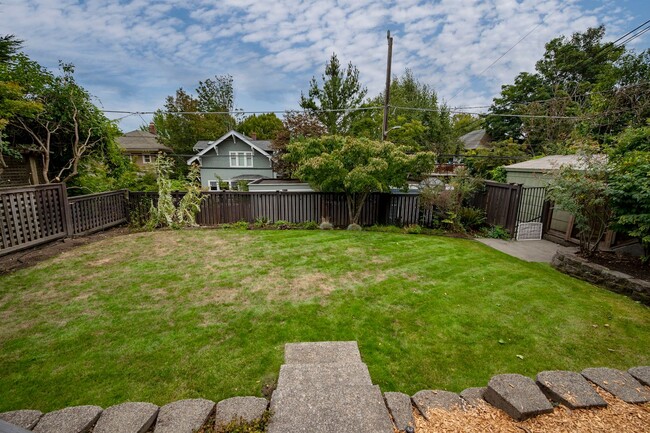 Building Photo - Traditional Four-Corner Craftsman Home on ...