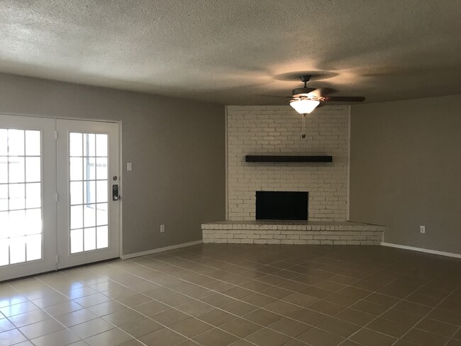 Family Room With Wood Burning Fireplace - 516 Mustang Drive