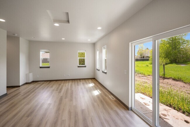 Building Photo - Pet Friendly! Gorgeous 3 Bedroom condo with double stall attached garages with AC.