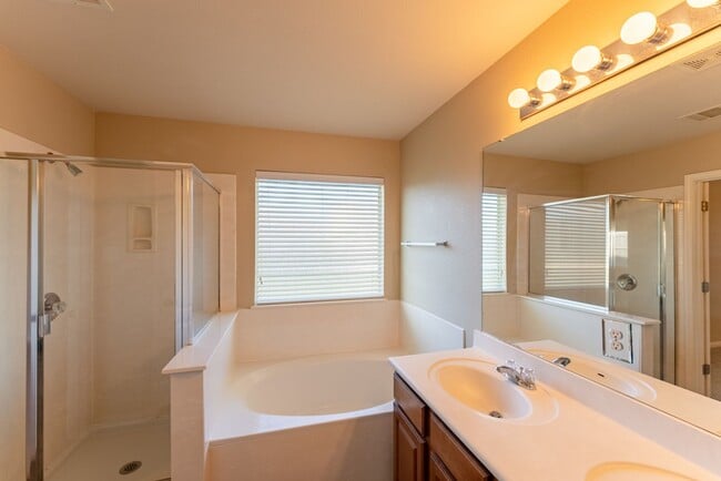 Building Photo - Charming Brick Home with Open Floorplan, Vaulted Ceilings, and Luxurious Amenities—Perfect for An...