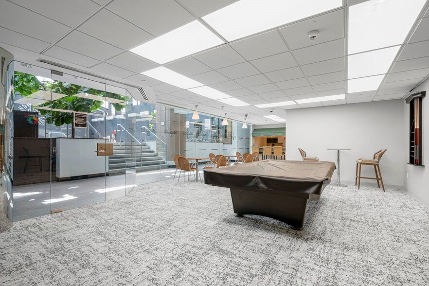 Community space with billiards and cafe area. Adjoining play/lounge space. - 4 Martine Ave