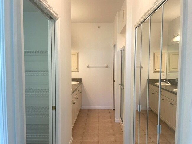 Building Photo - Elegant 3 Bedroom End-Unit Condo with Screened Lanai & Pond Views and A Private Garage