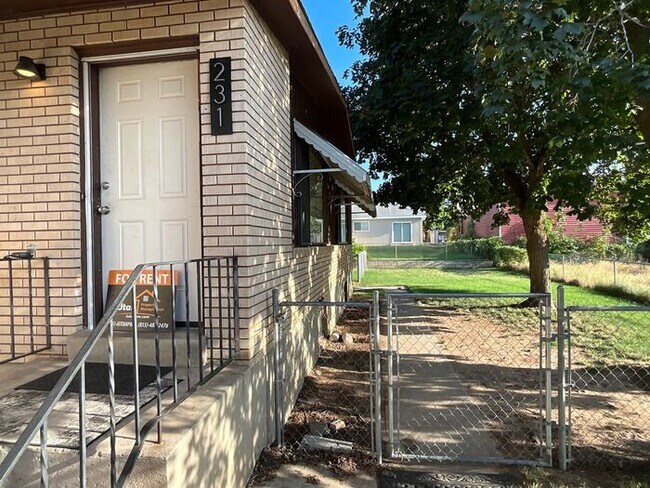 Building Photo - 4 Bedroom 2 Bath Duplex- Carport